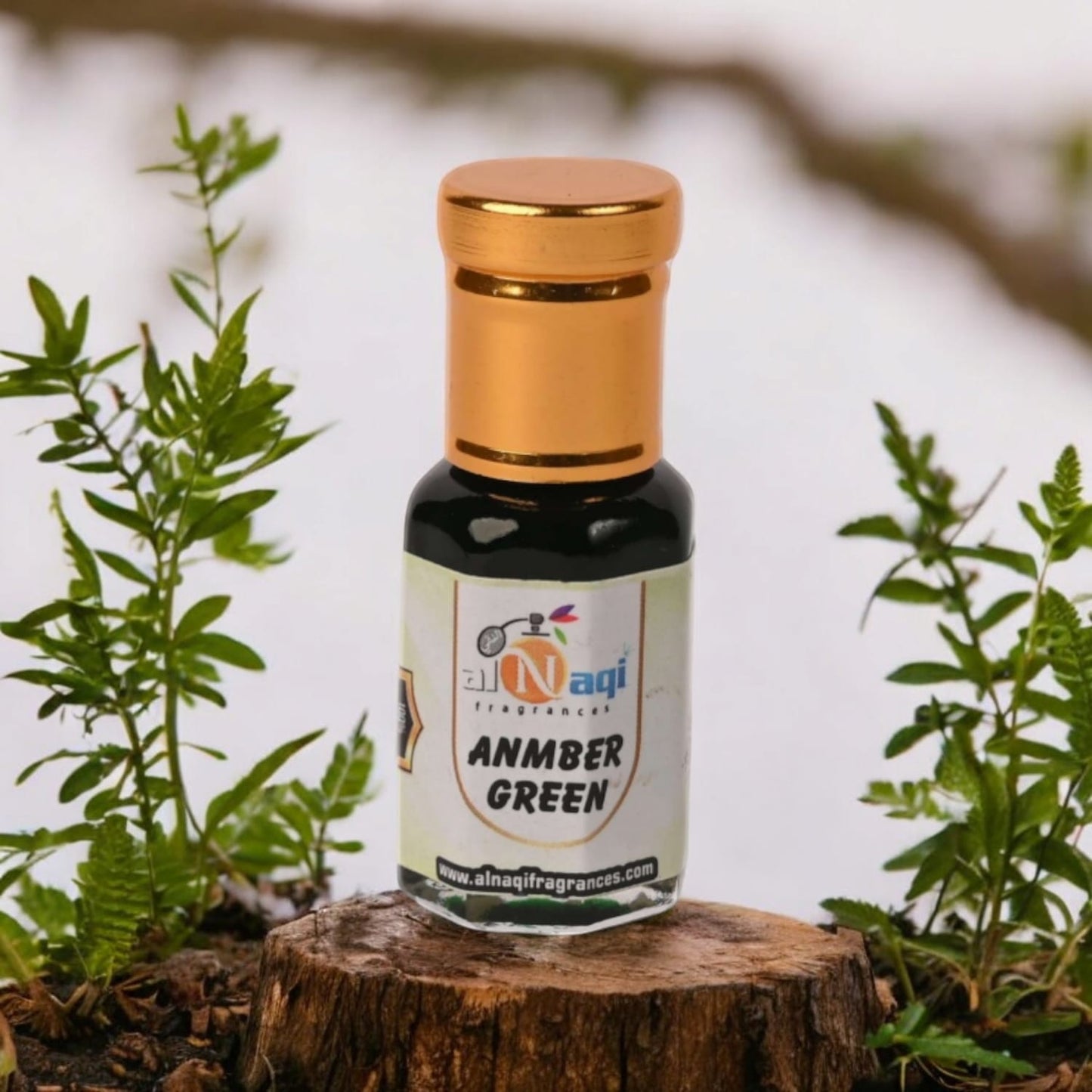 Close-up of Alnaqi Amber Green Attar showcasing luxurious packaging