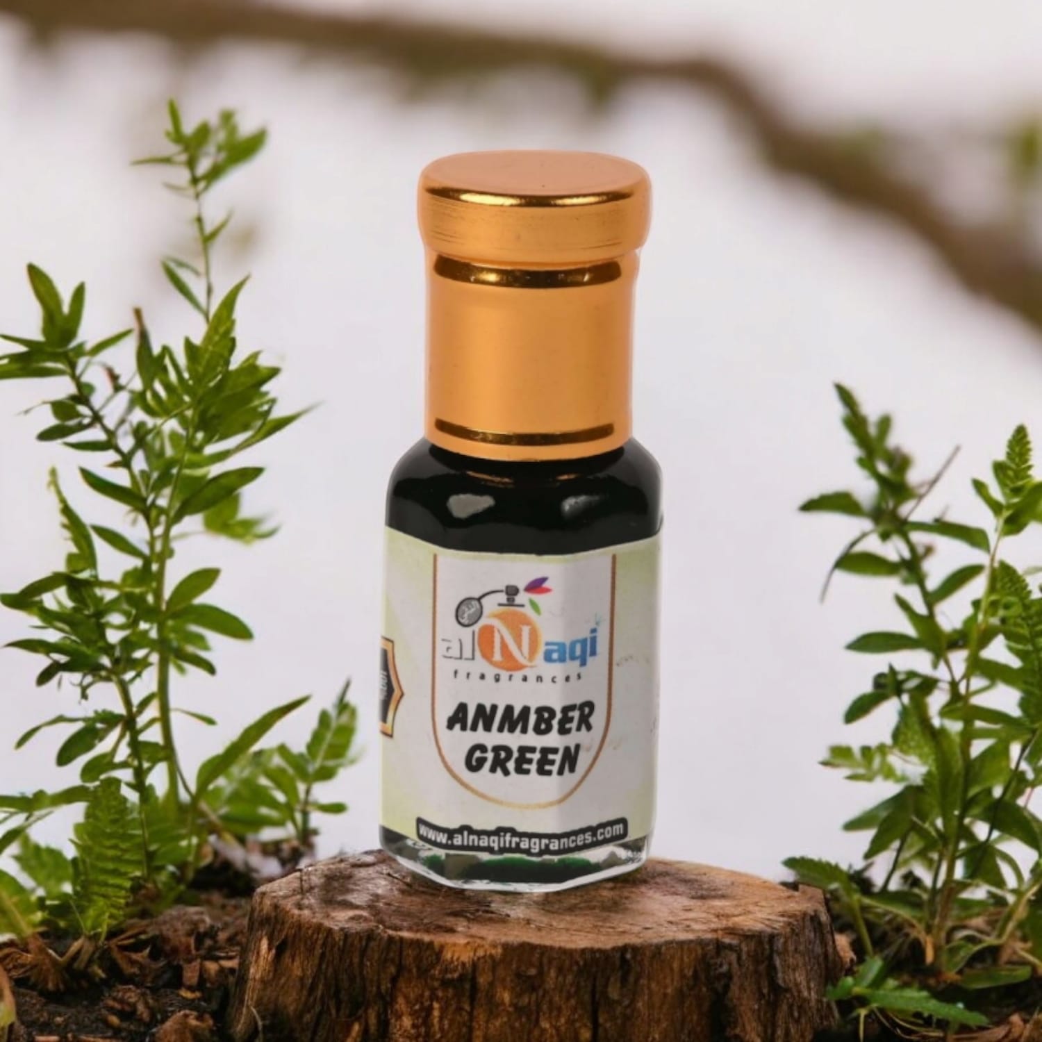 Close-up of Alnaqi Amber Green Attar showcasing luxurious packaging