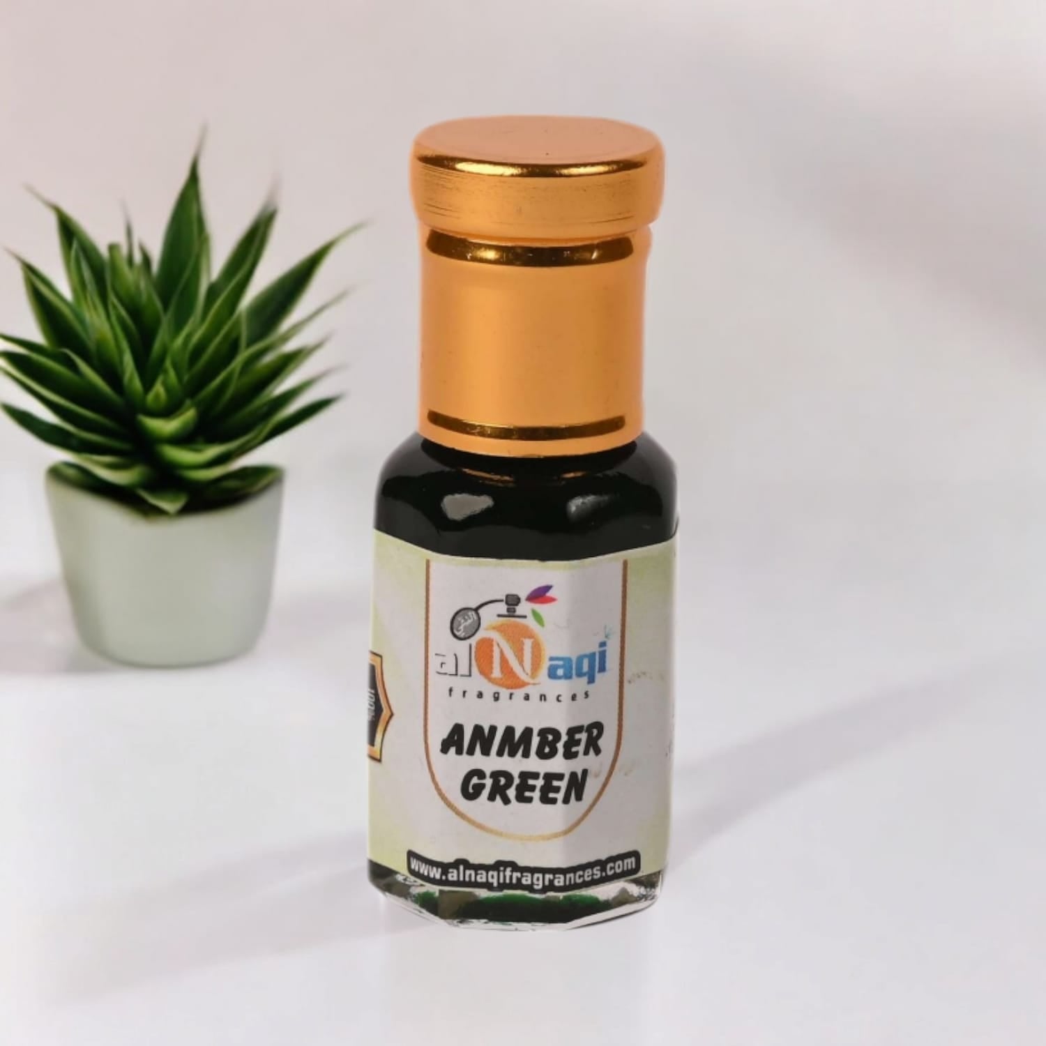 Alnaqi Amber Green Attar displayed on a sophisticated background