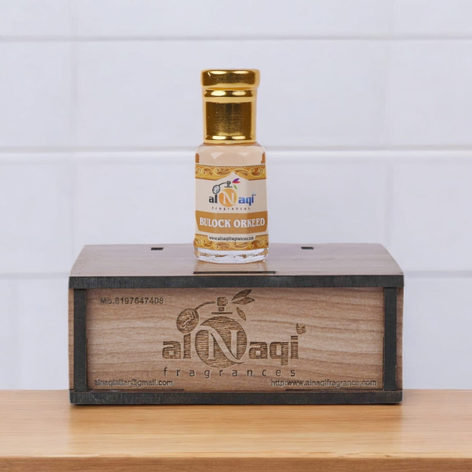 Premium attar displayed on a modern, reflective surface