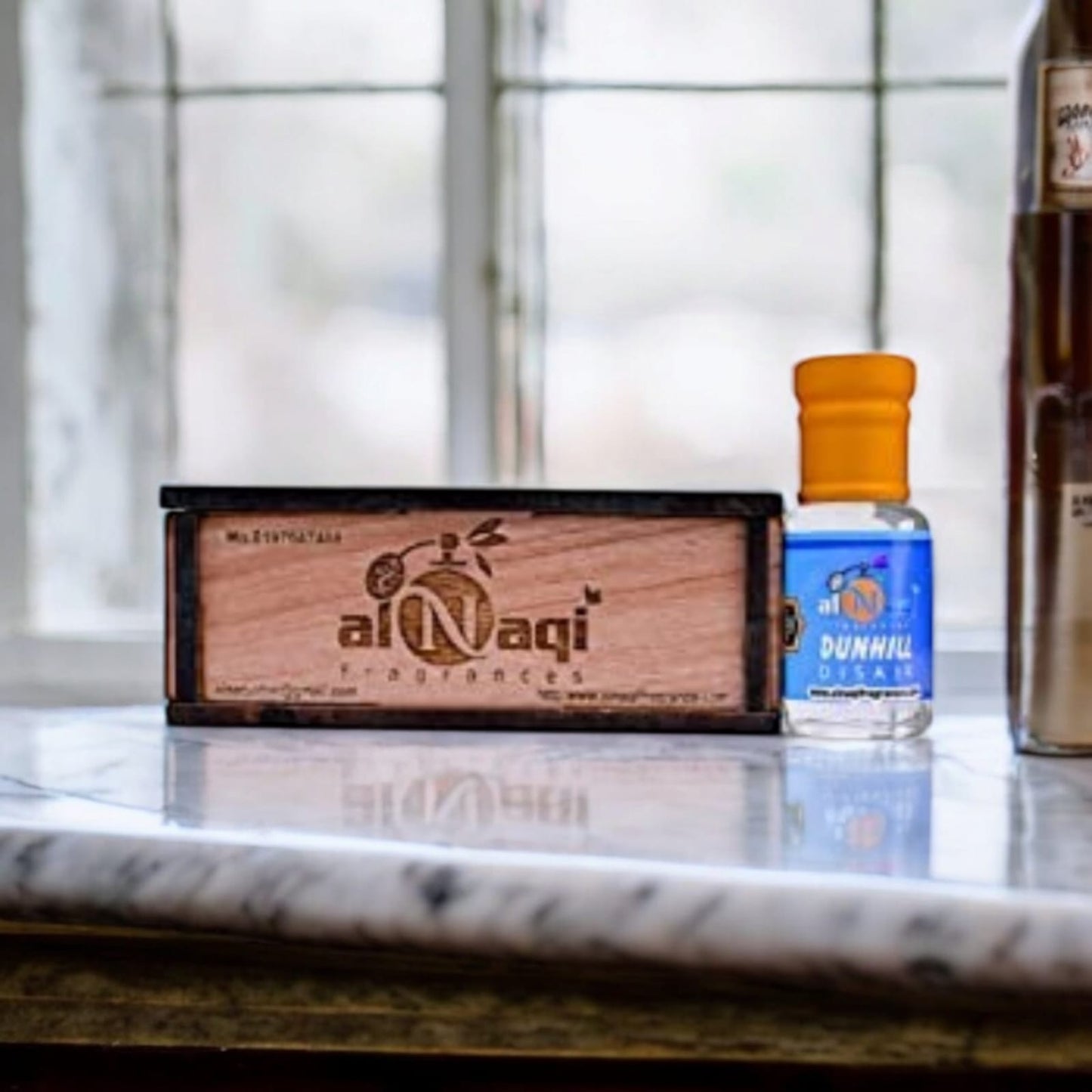 Detail shot of the Dunhill Disair Attar packaging