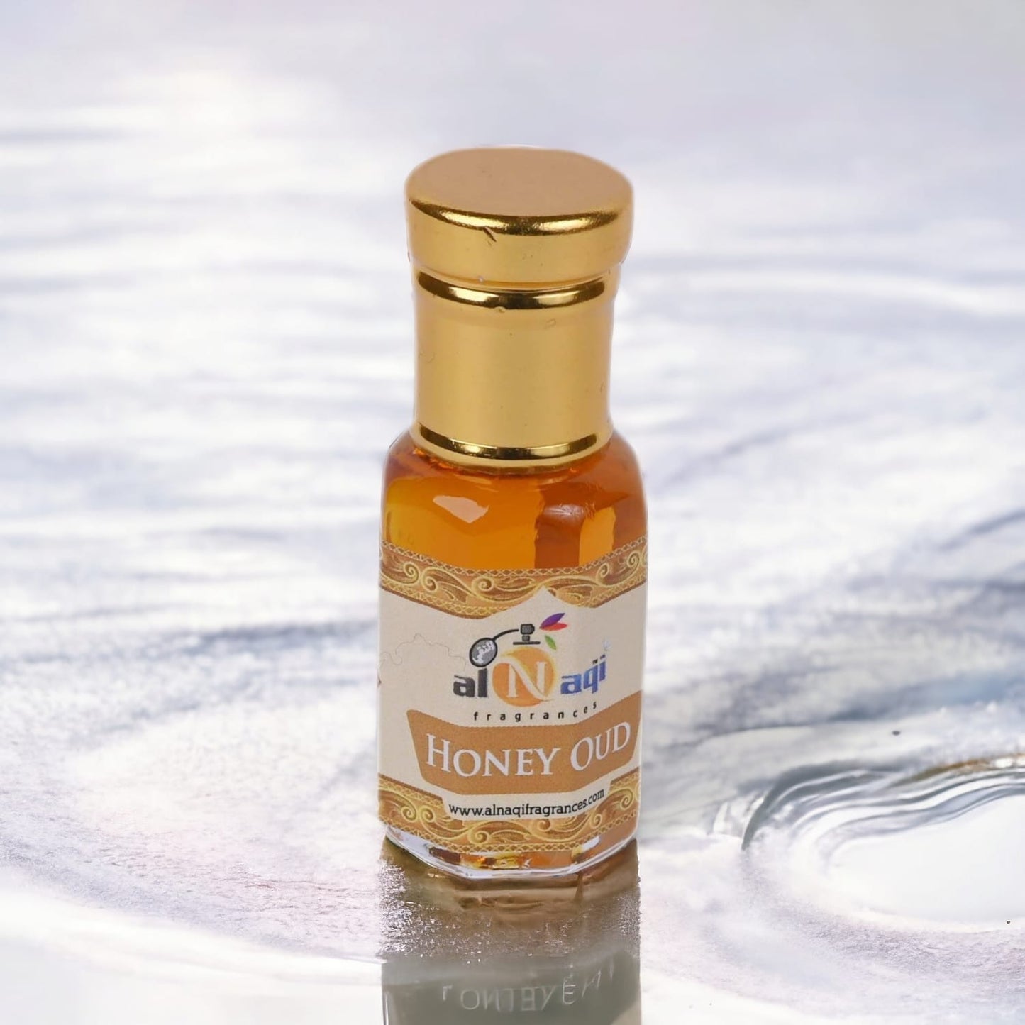 Perfume bottle surrounded by honeycomb and aromatic spices