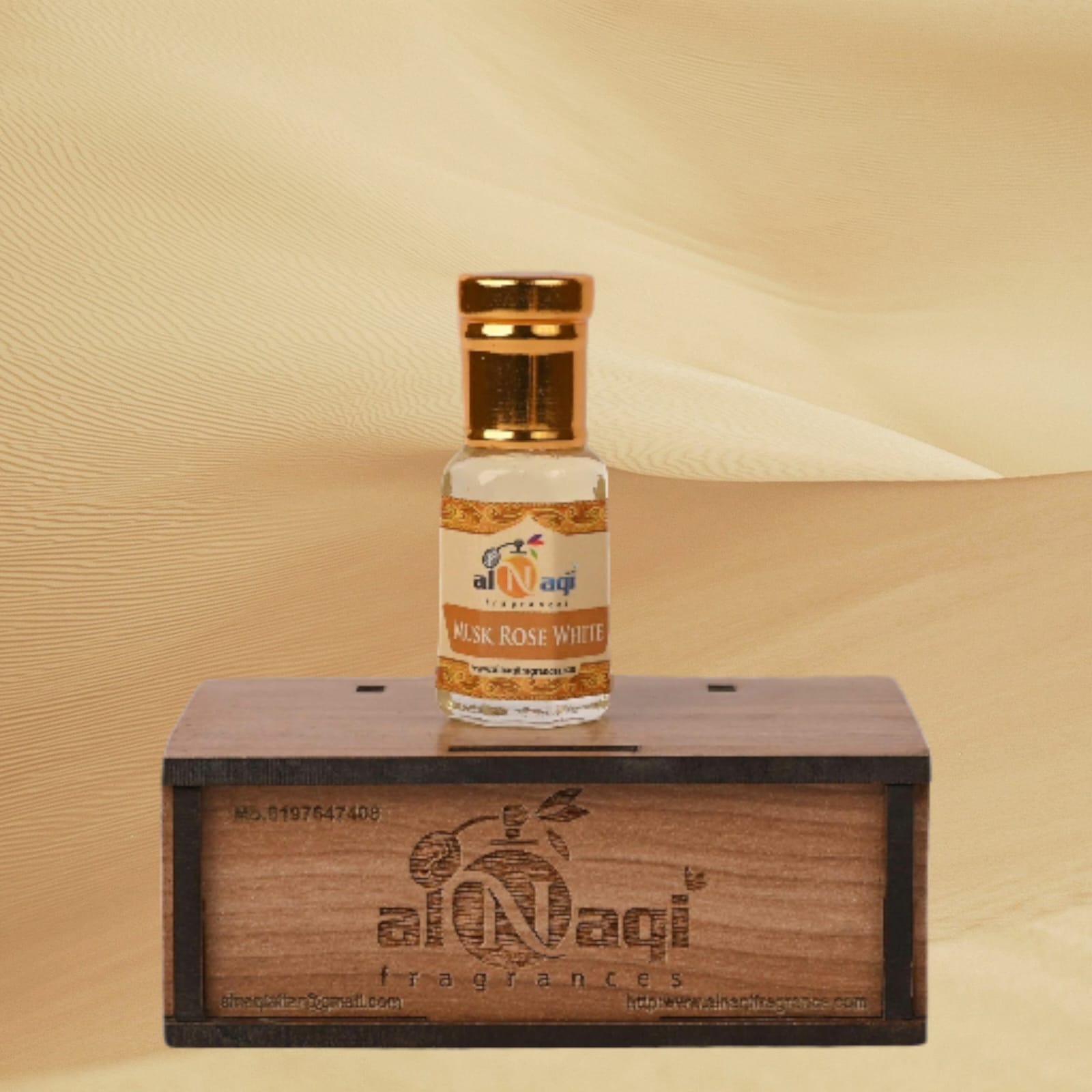 Close-up of rose petals and musk in a perfume bottle
