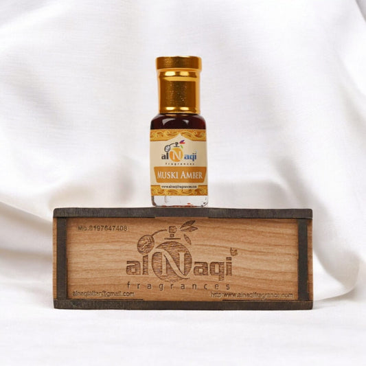 Amber-colored perfume bottle with intricate design