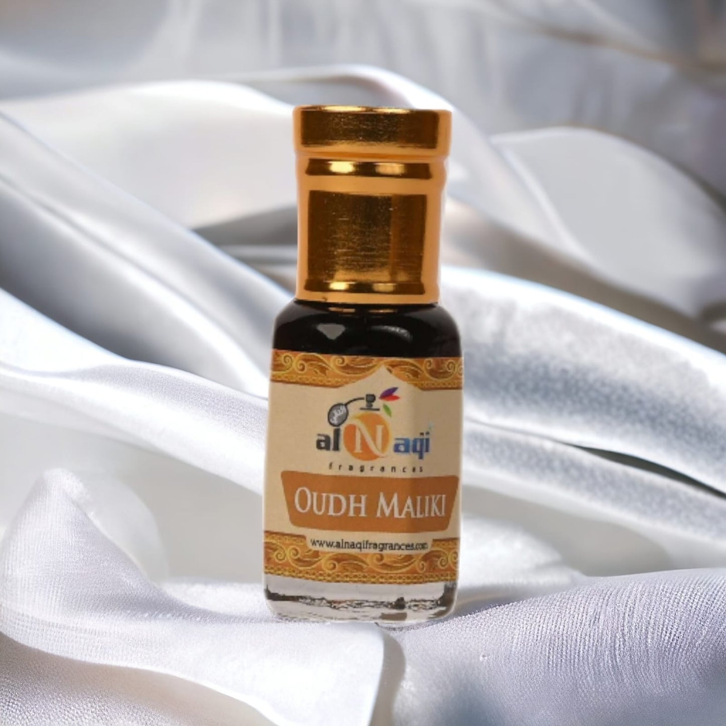 Close-up of the rich golden liquid in an ornate perfume bottle.