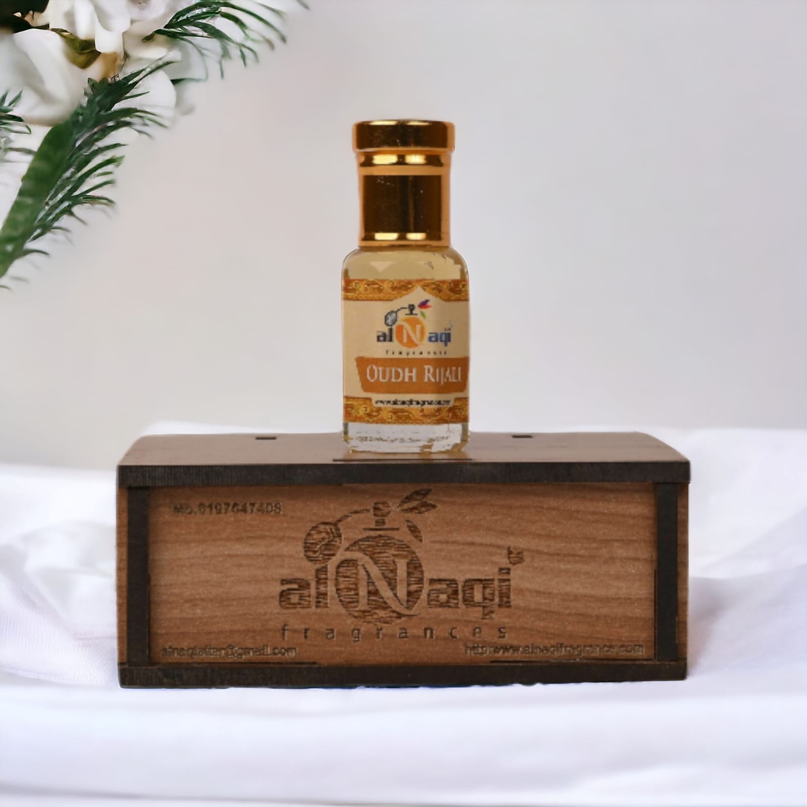 Elegant glass bottle of premium perfume with intricate design.