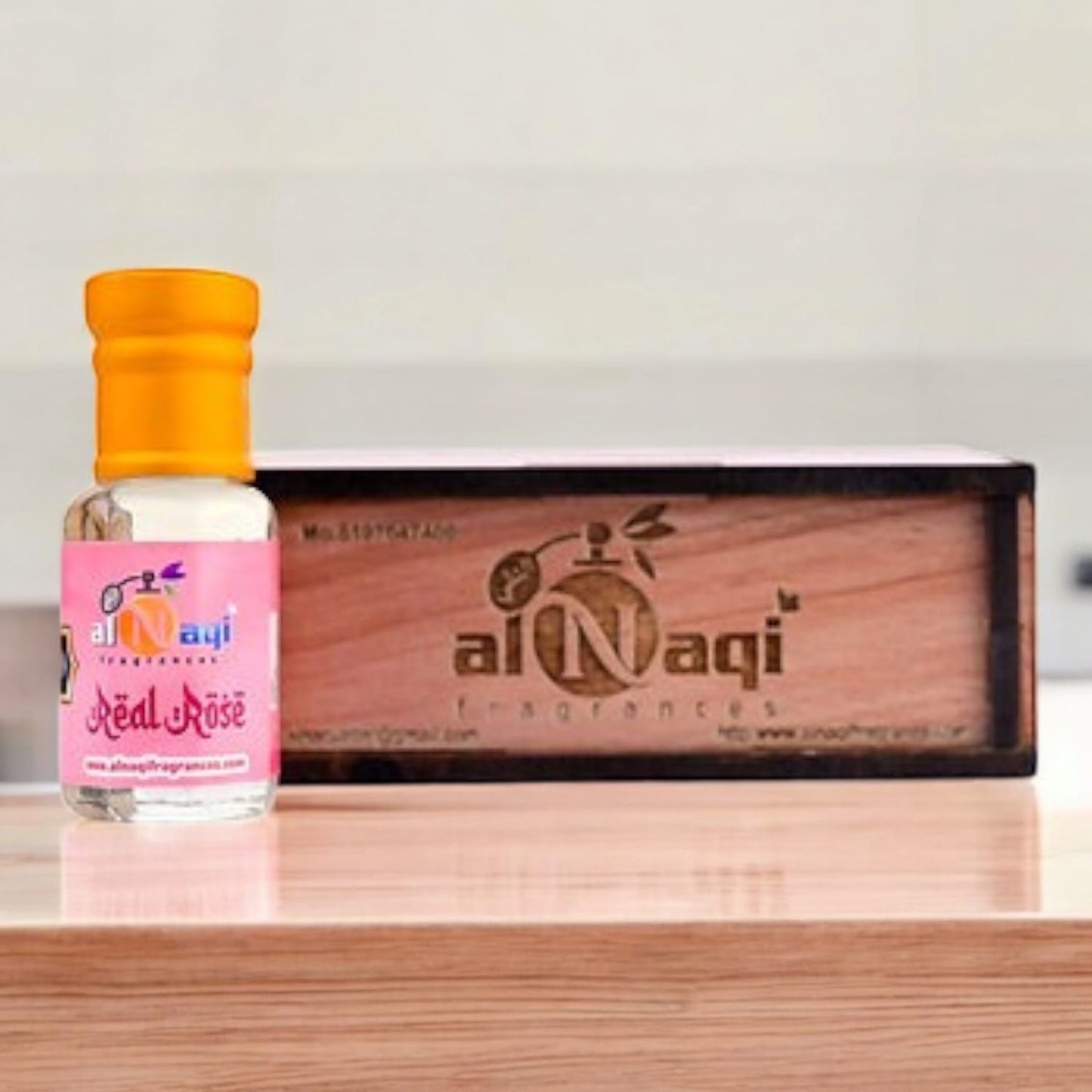 Close-up of intricate details on the rose attar bottle