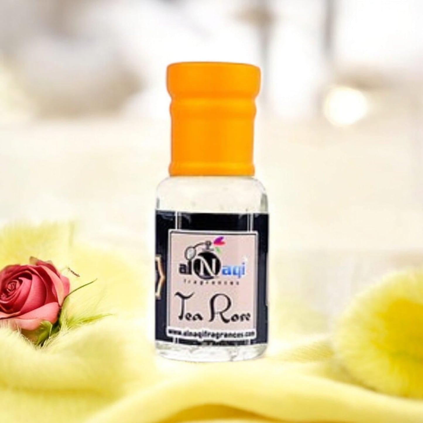 Alnaqi Tea Rose Essence in a luxurious display setting