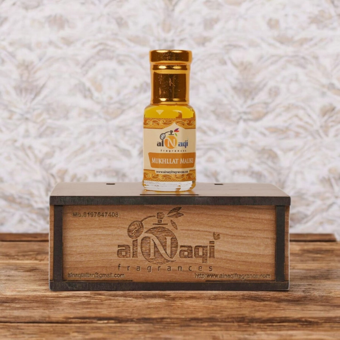 Close-up of Mukhallat Maliki attar showcasing its rich golden hue