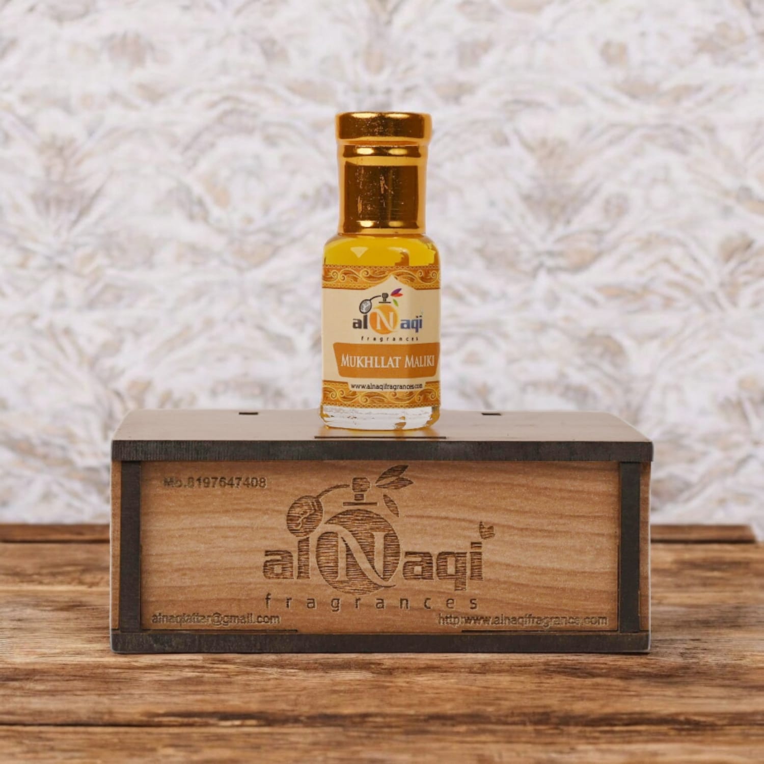 Close-up of Mukhallat Maliki attar showcasing its rich golden hue
