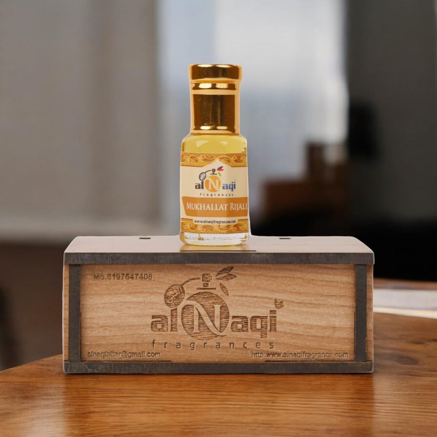 Packaging of Mukhallat Rijali attar featuring intricate details