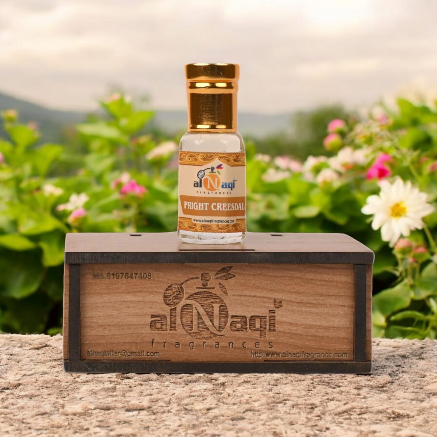 Attar packaging with intricate design placed on a dark background