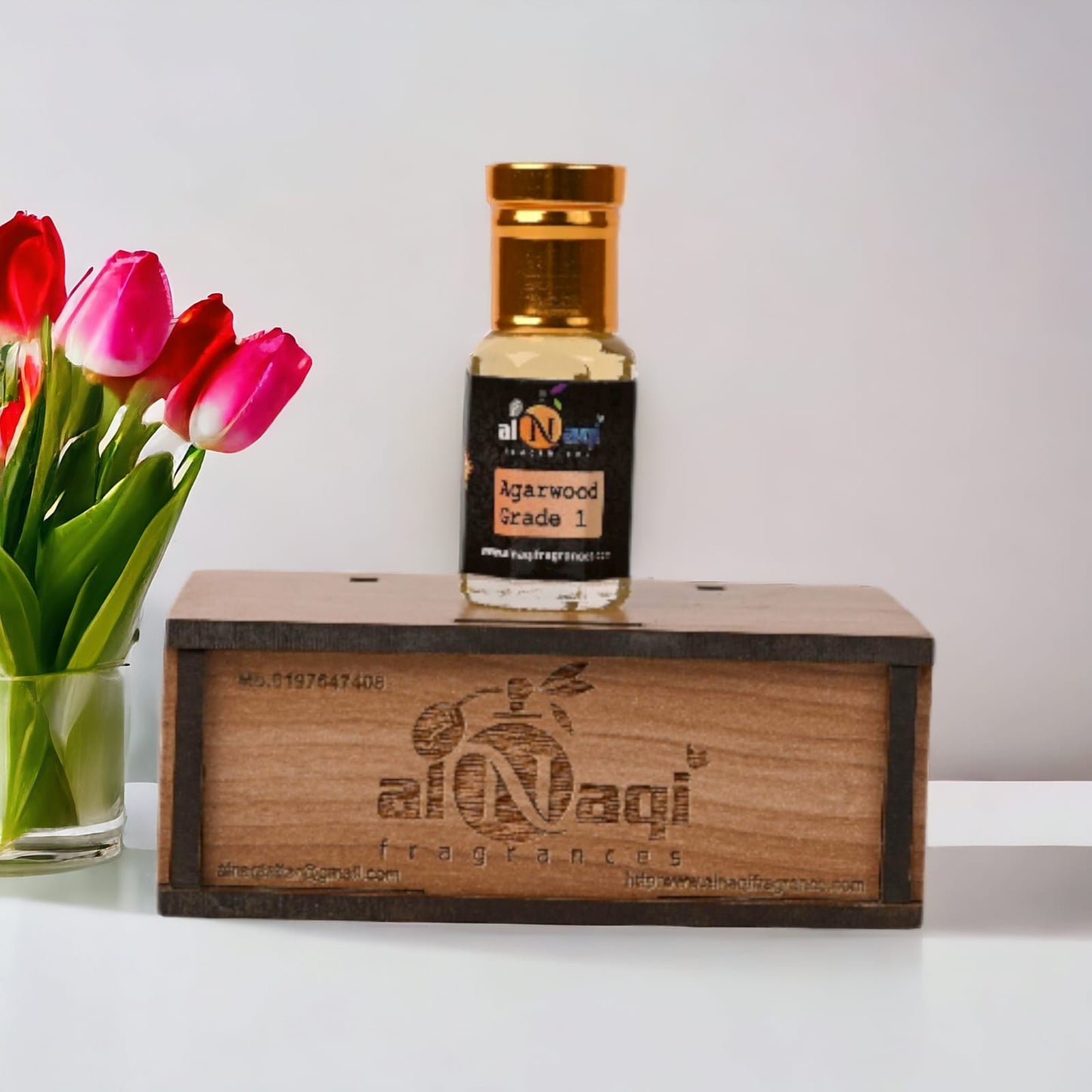 Elegant glass bottle of premium attar with a golden cap