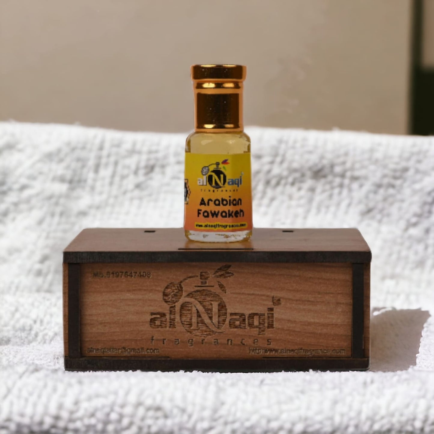 Elegant bottle of Arabian Fawakeh Attar with intricate design.