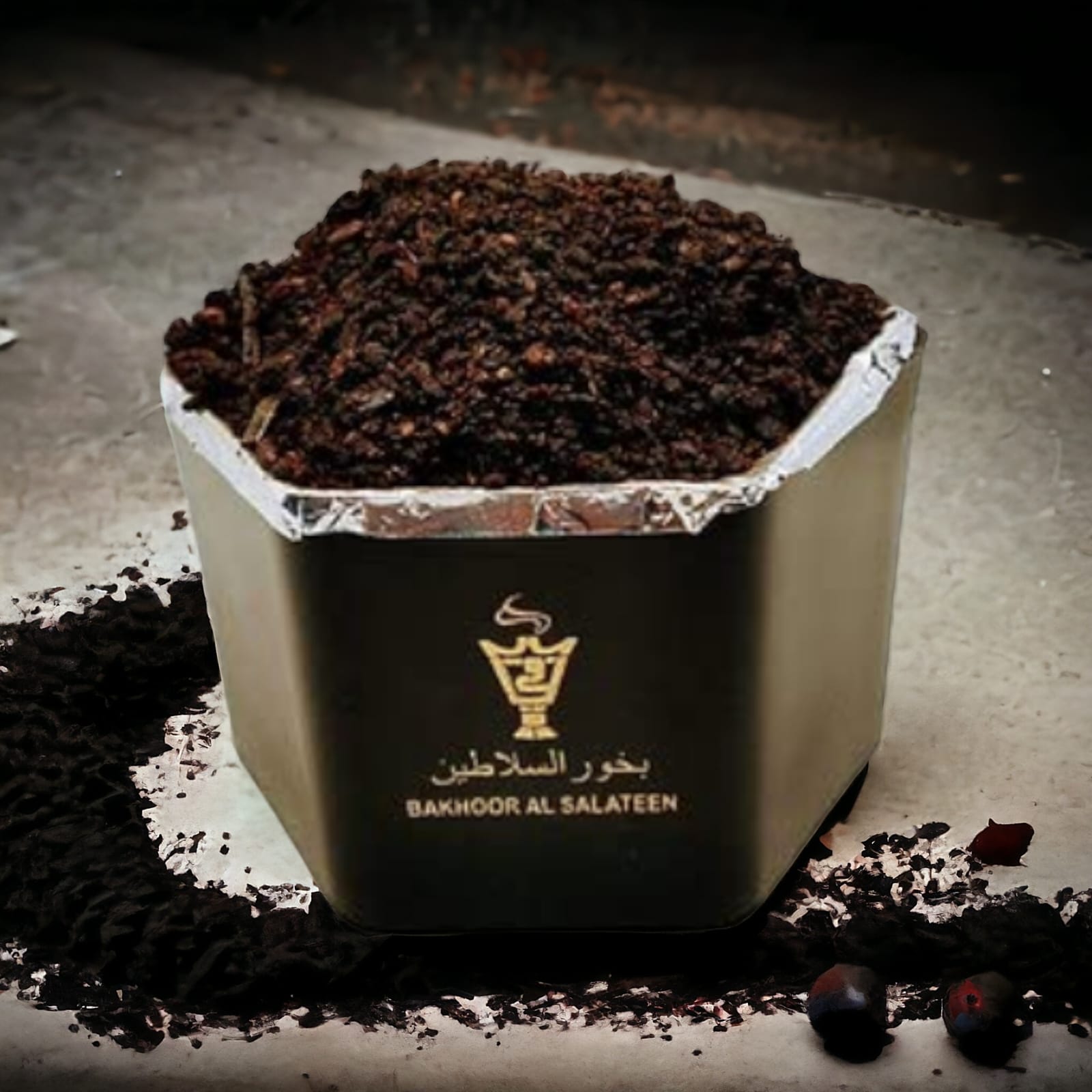 Aromatic bakhoor pieces on a traditional burner