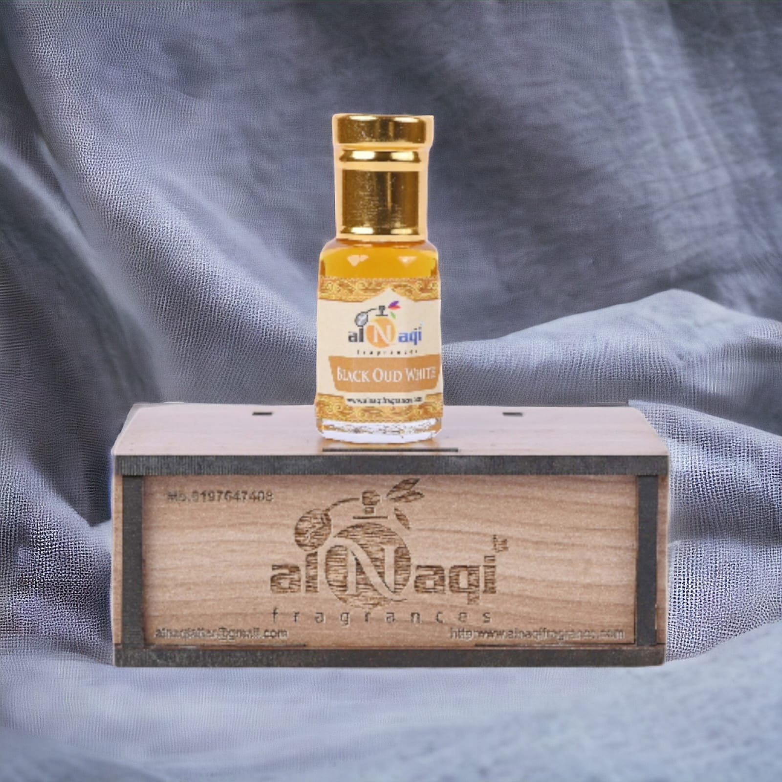 Sleek glass bottle of premium dark perfume with a silver cap