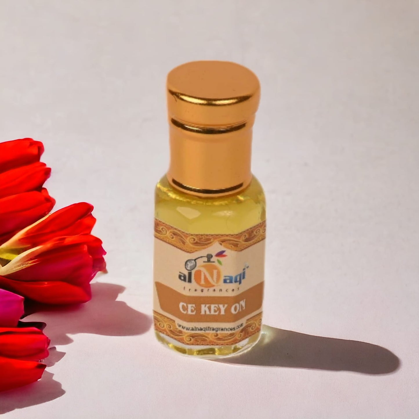 Close-up of fragrance bottle with gold accents