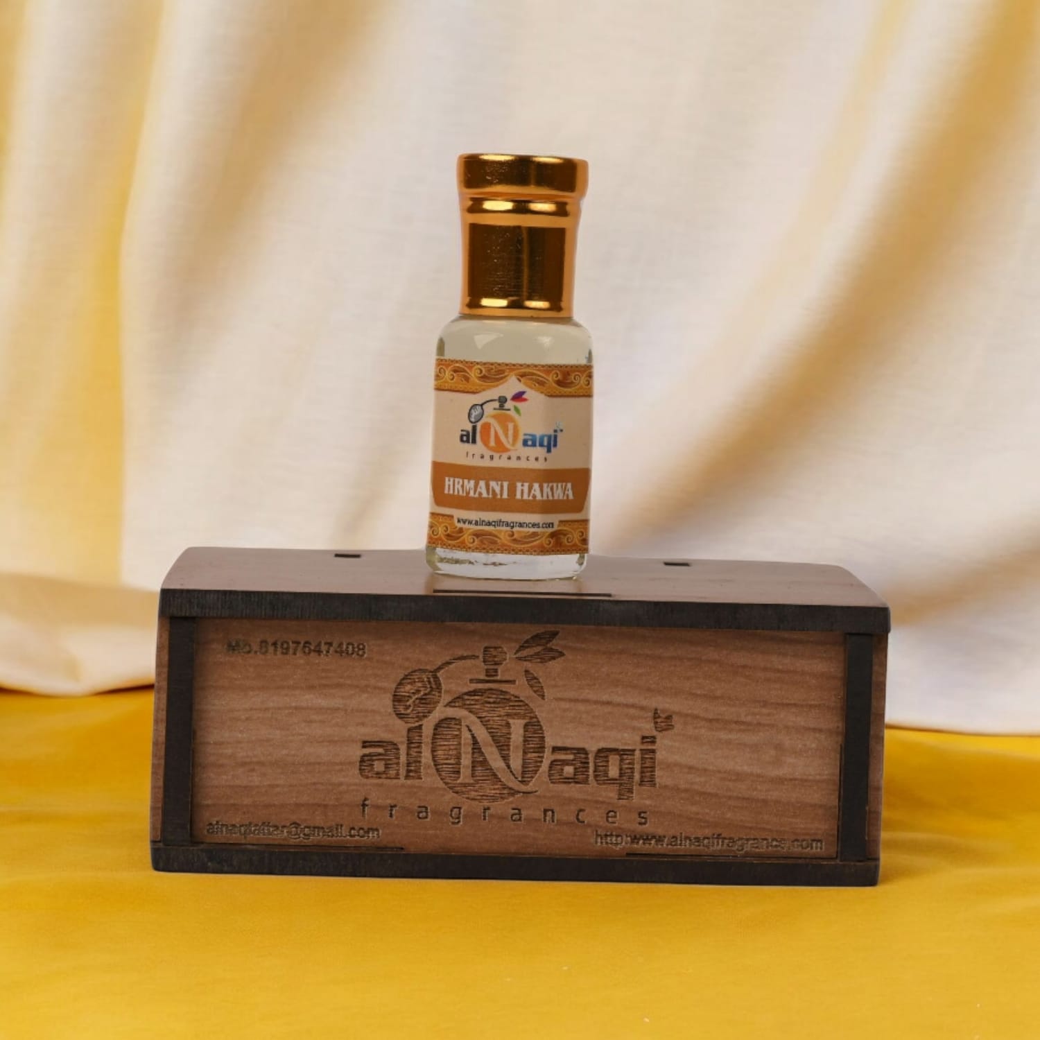 Elegant bottle of Harmani Hakwa attar with intricate design details.