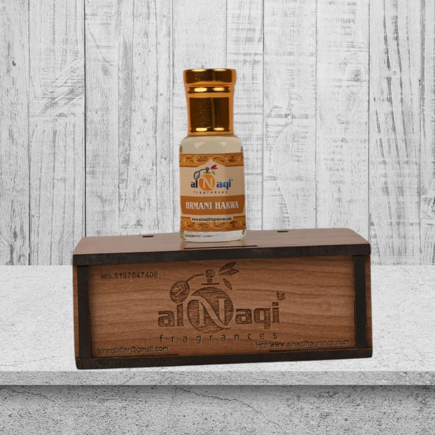 Close-up view of the luxurious attar housed in a sleek, modern glass container.