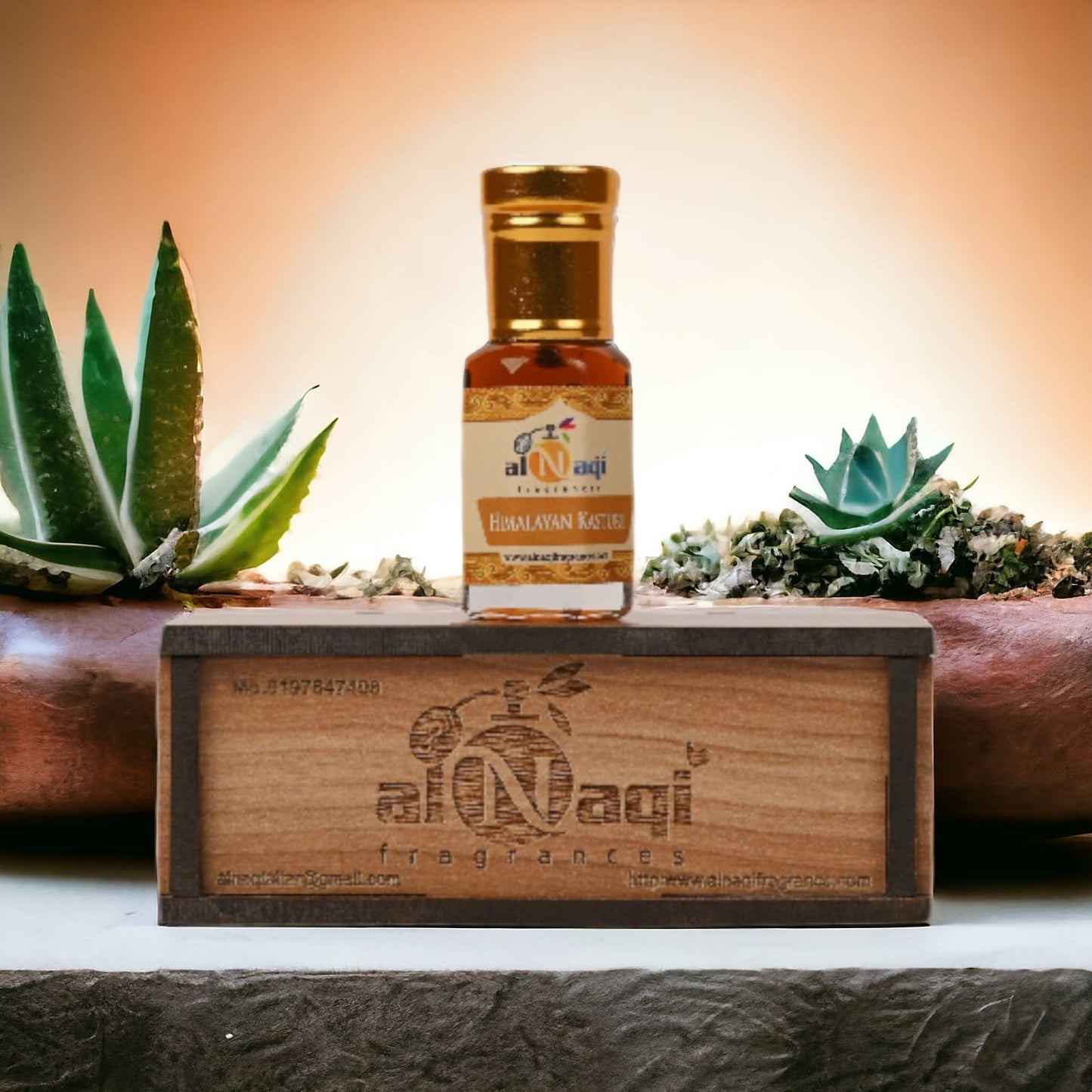 Himalayan Kasturi Attar displayed with natural wood and floral elements. .
