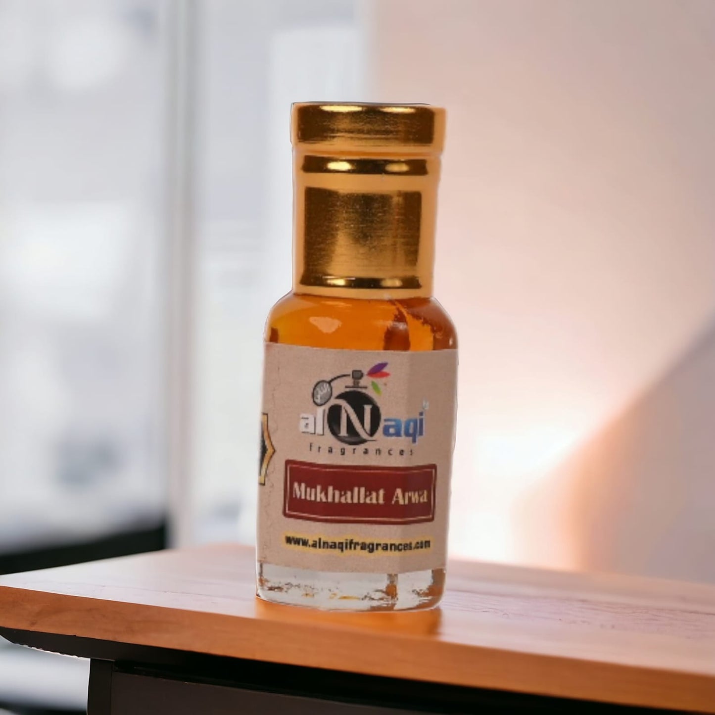 Applying Arabian Musk Attar to the wrist, showcasing its application.