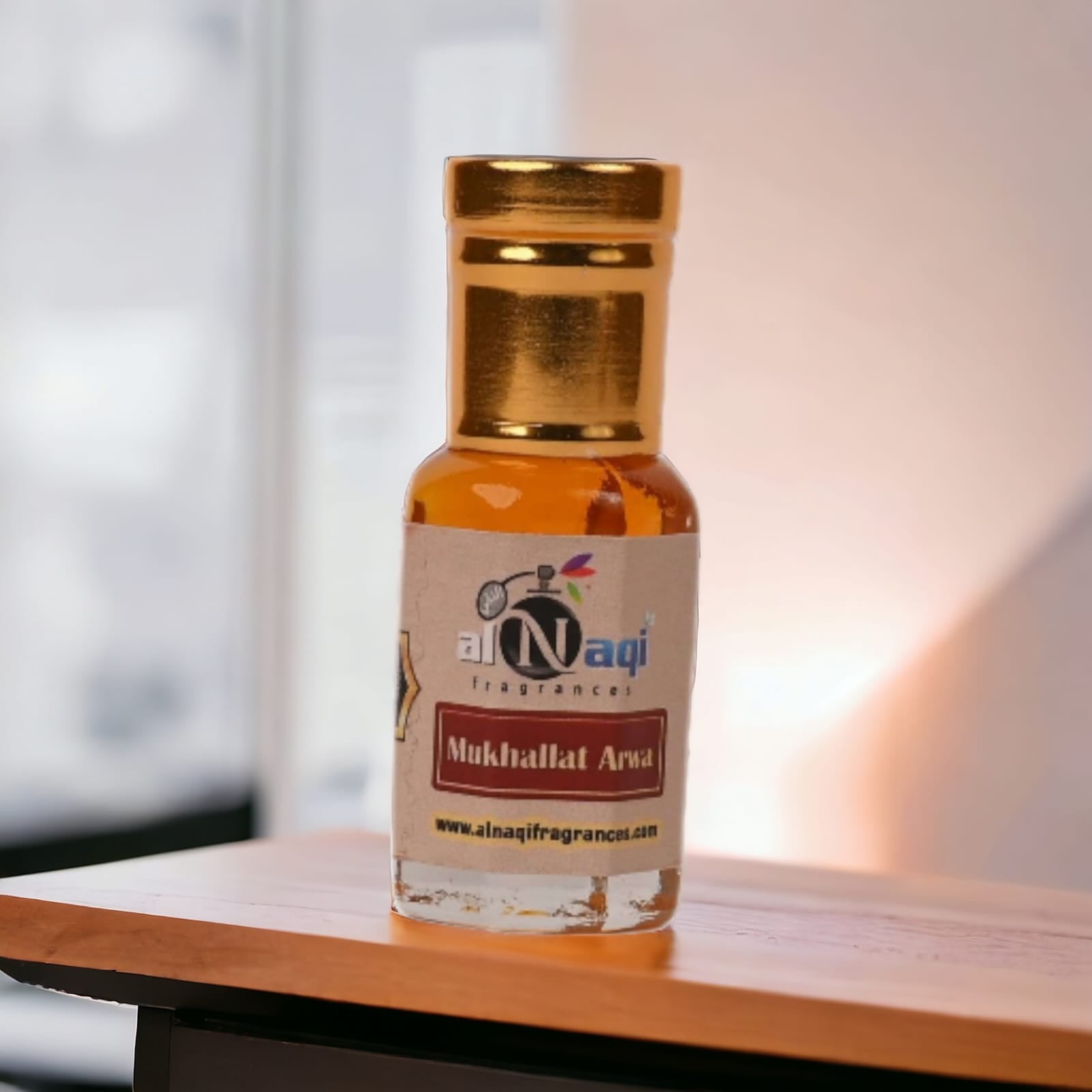 Applying Arabian Musk Attar to the wrist, showcasing its application.