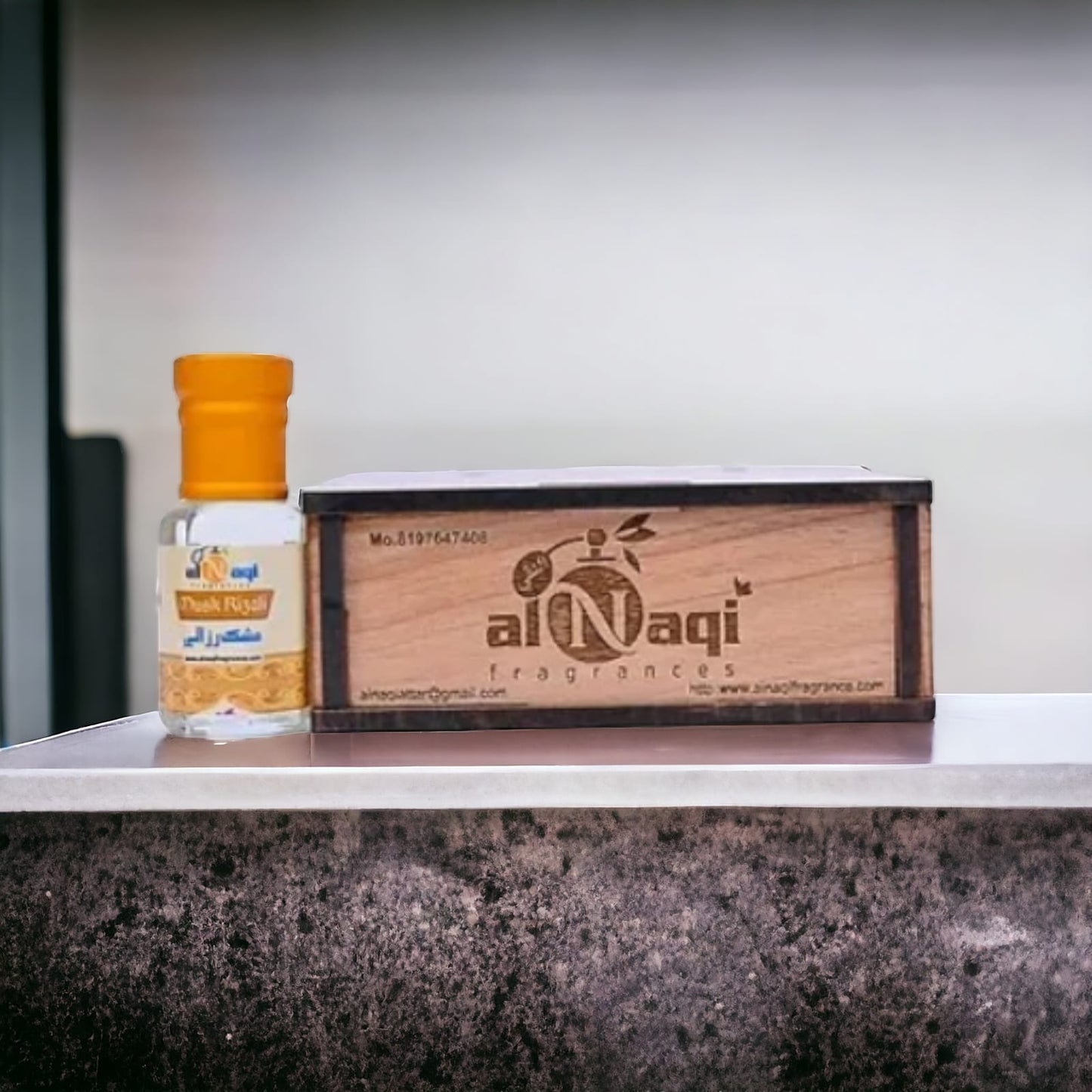 Musk Rizali Attar displayed with luxurious spices and aromatic ingredients.