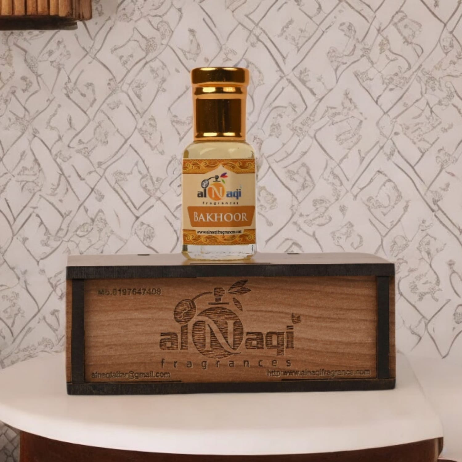 Elegant bottle of Bhakoor Attar with intricate design details.