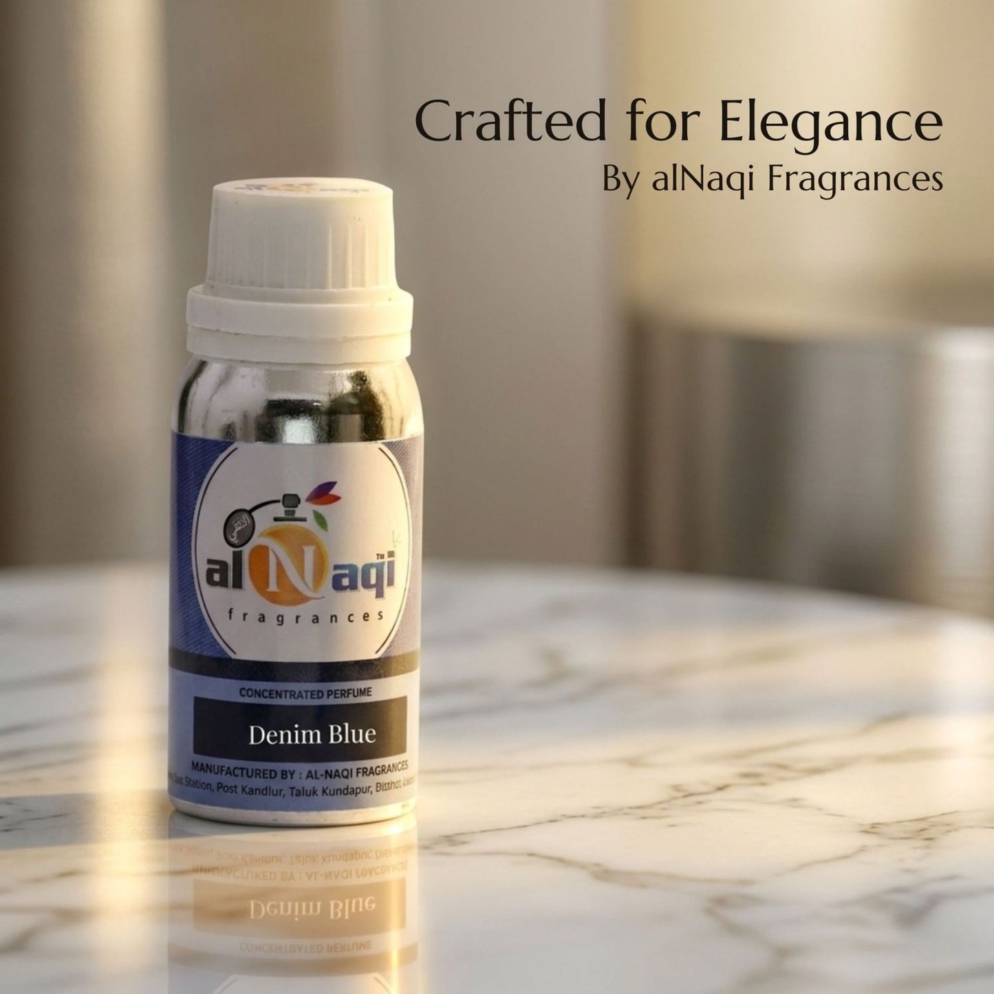 alNaqi Fragrances Denim Blue perfume bottle on a marble surface with blurred background