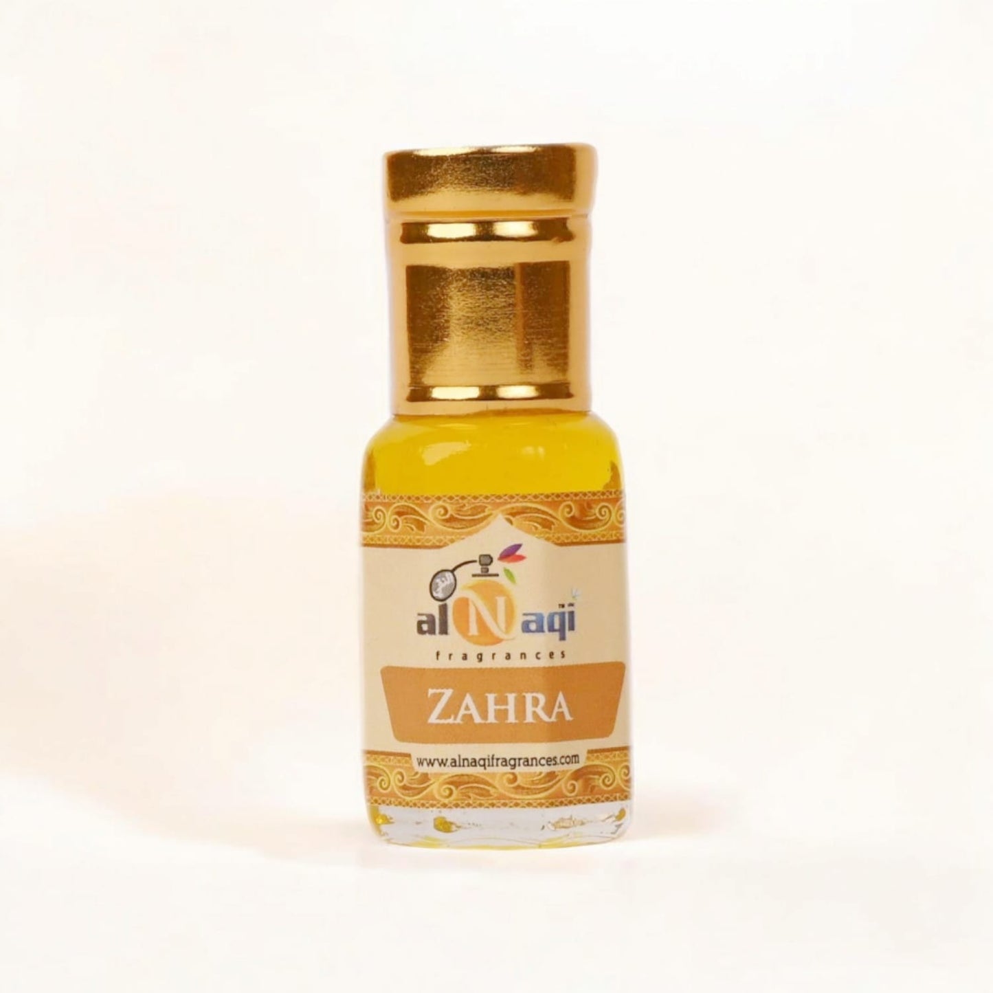 Close-up view of the rich, floral liquid inside the Zahra Essence bottle.