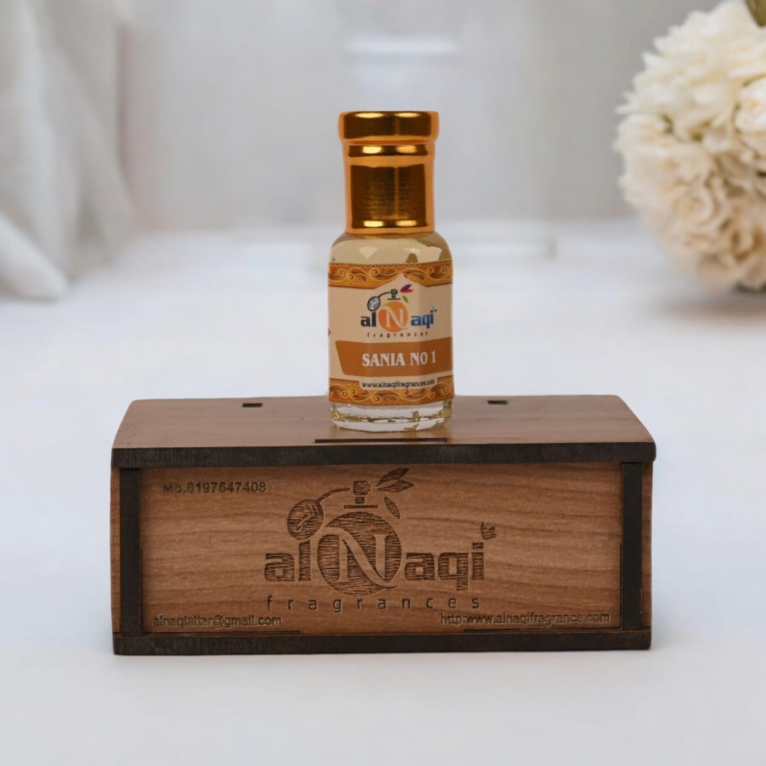 A vibrant presentation of the attar with hints of citrus, floral, and woody elements symbolized around it.
