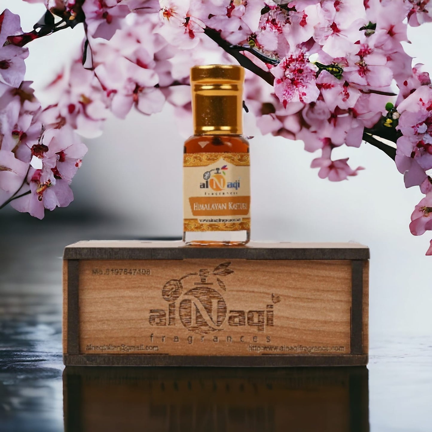 Elegant bottle of Himalayan Kasturi Attar with intricate gold detailing.