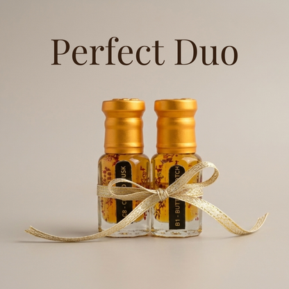 Two small bottles with gold caps and a ribbon on a beige background, labeled 'Perfect Duo'.