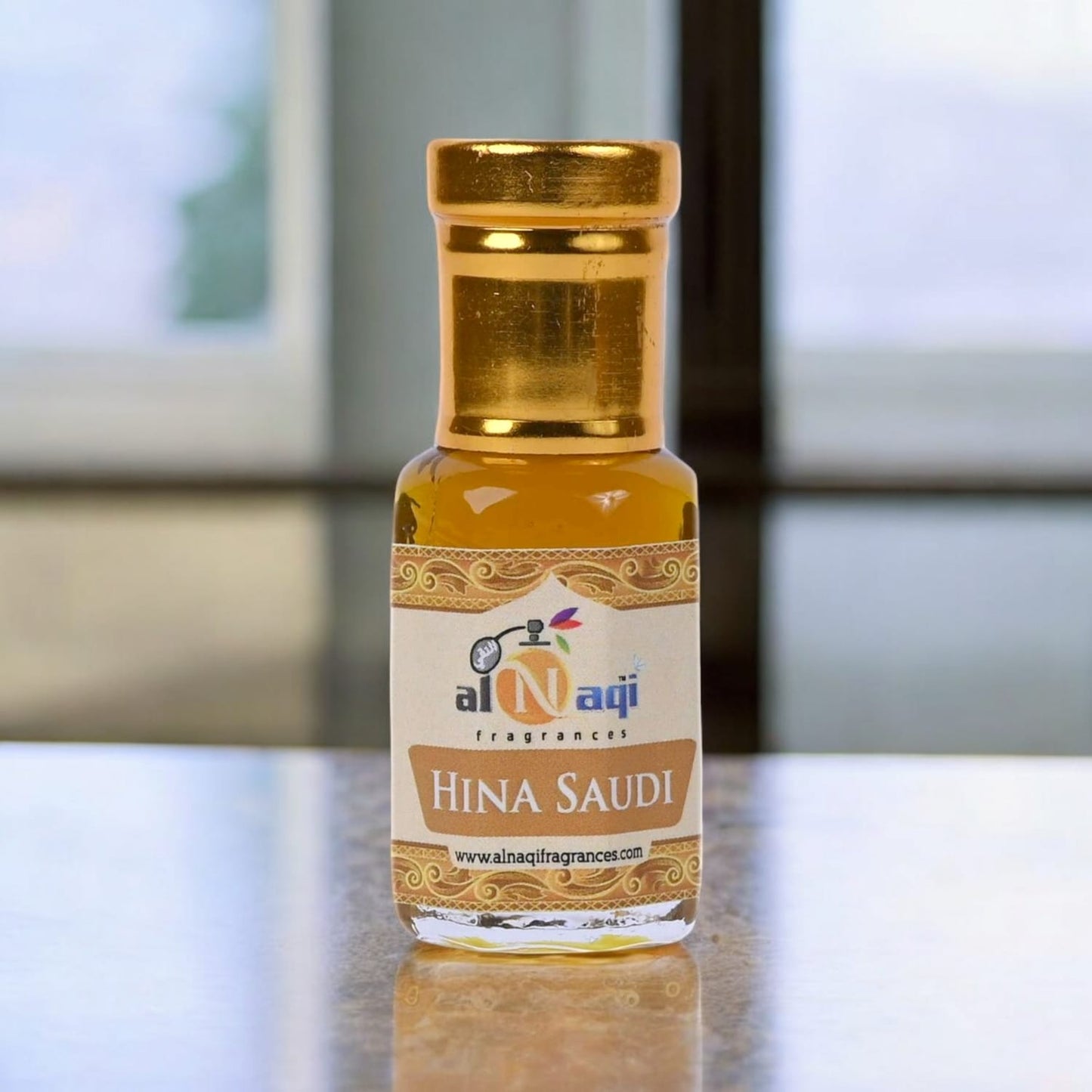 Elegant bottle of Alnaqi Hina Attar with intricate design
