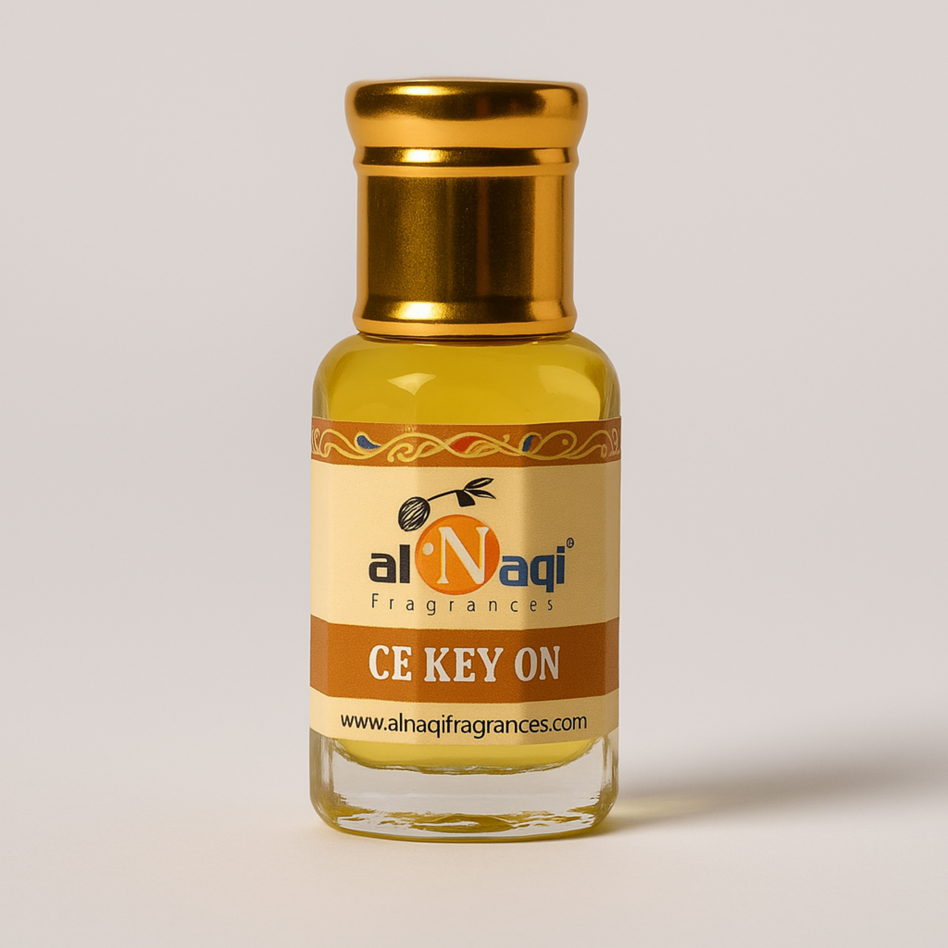 Fragrance bottle with gold cap and labeled CA KEY ON on a light gray background