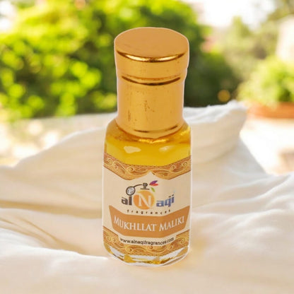 Stylish packaging of Mukhallat Maliki attar with decorative design
