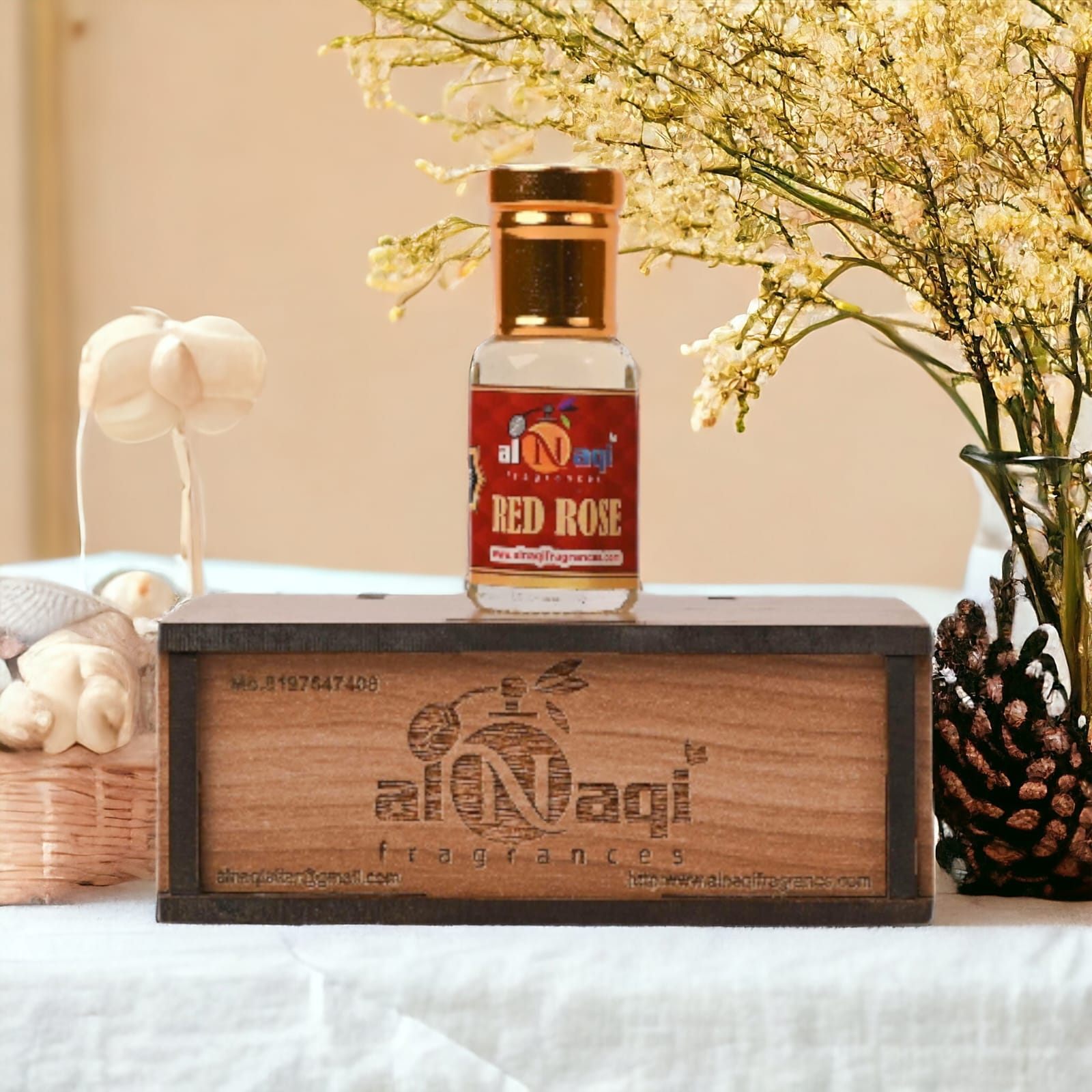 Richly scented red rose attar in a classic glass vial
