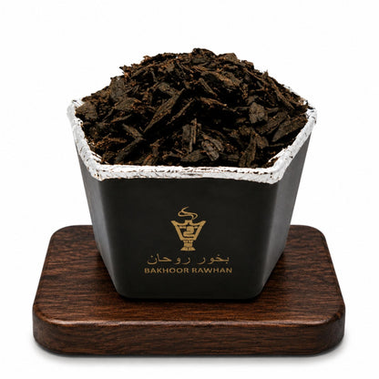 Front view of Alnaqi Bakhoor Rawhan 50g jar containing natural aromatic wood chips