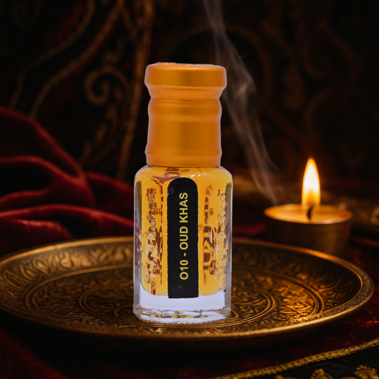 Small bottle labeled 'Oud Khas' on a decorative tray with a candle in the background