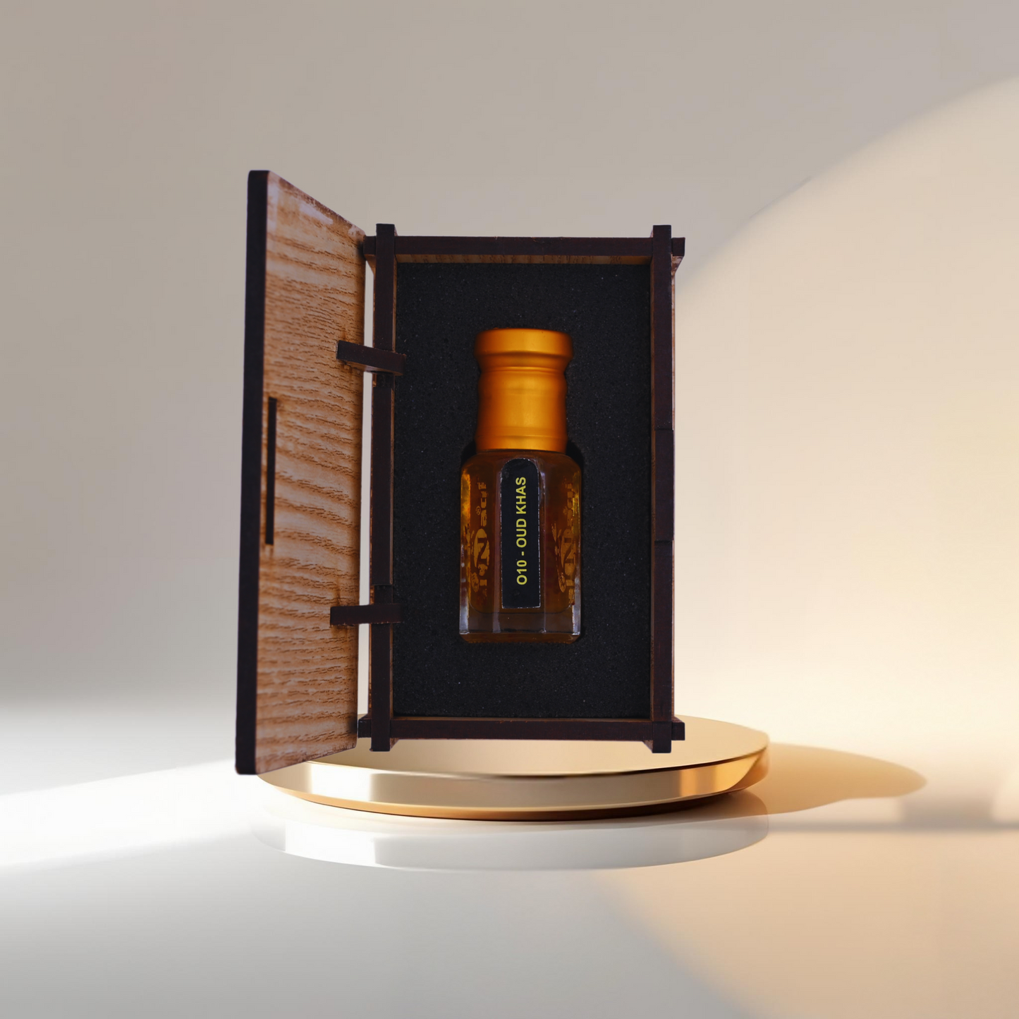 Brown bottle with gold cap inside an open wooden box on a white background