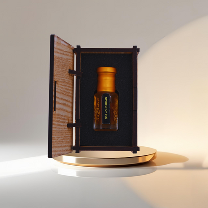 Brown bottle with gold cap inside an open wooden box on a white background