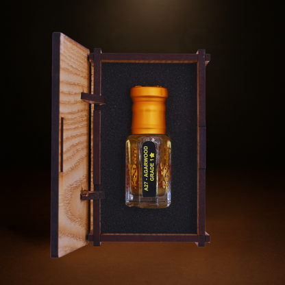 Small bottle of AYR Agarwood in a wooden box with a dark background