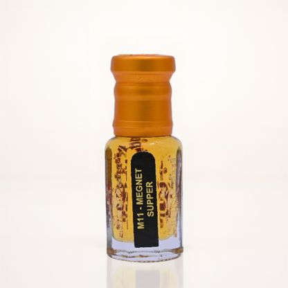 Small glass bottle with an orange cap on a white background