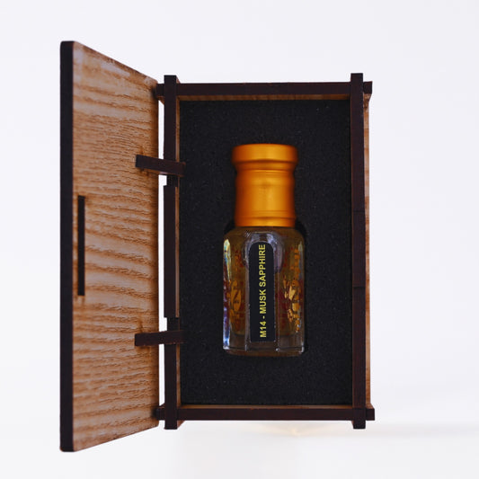 Small bottle of musk perfume with a lit candle in the background, text 'Appreciate Timeless Fragrance'.