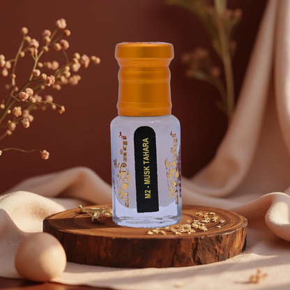 Bottle of M2 Musk Tahara on a wooden platform with a blurred background