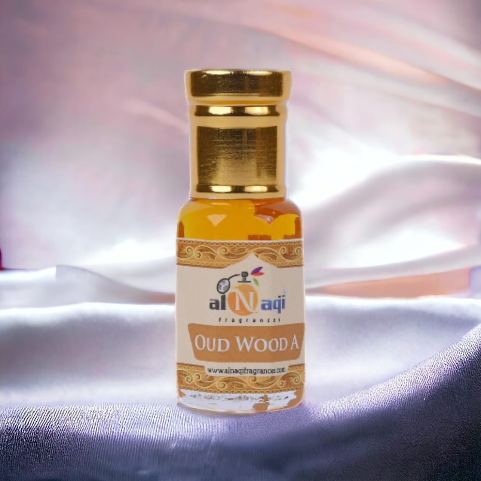 Premium oud attar in an elegant glass bottle
