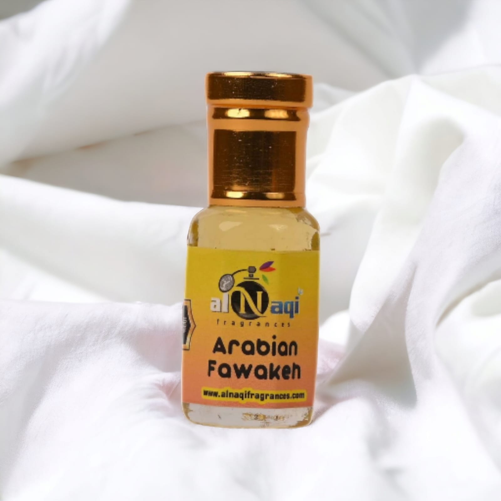 Arabian Fawakeh Attar displayed with fresh fruits and flowers. 