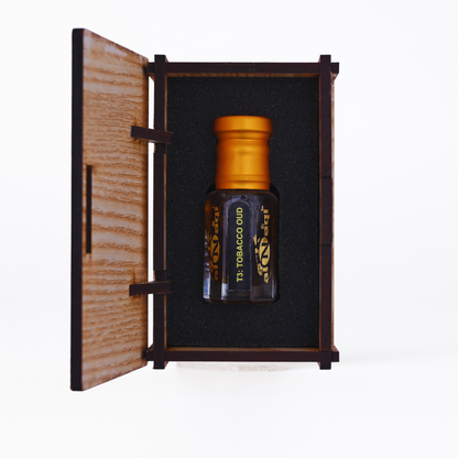 Tobacco oil bottle in a wooden box on a white background