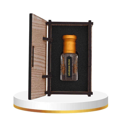 Perfume bottle with wooden cap in an open wooden box on a white platform
