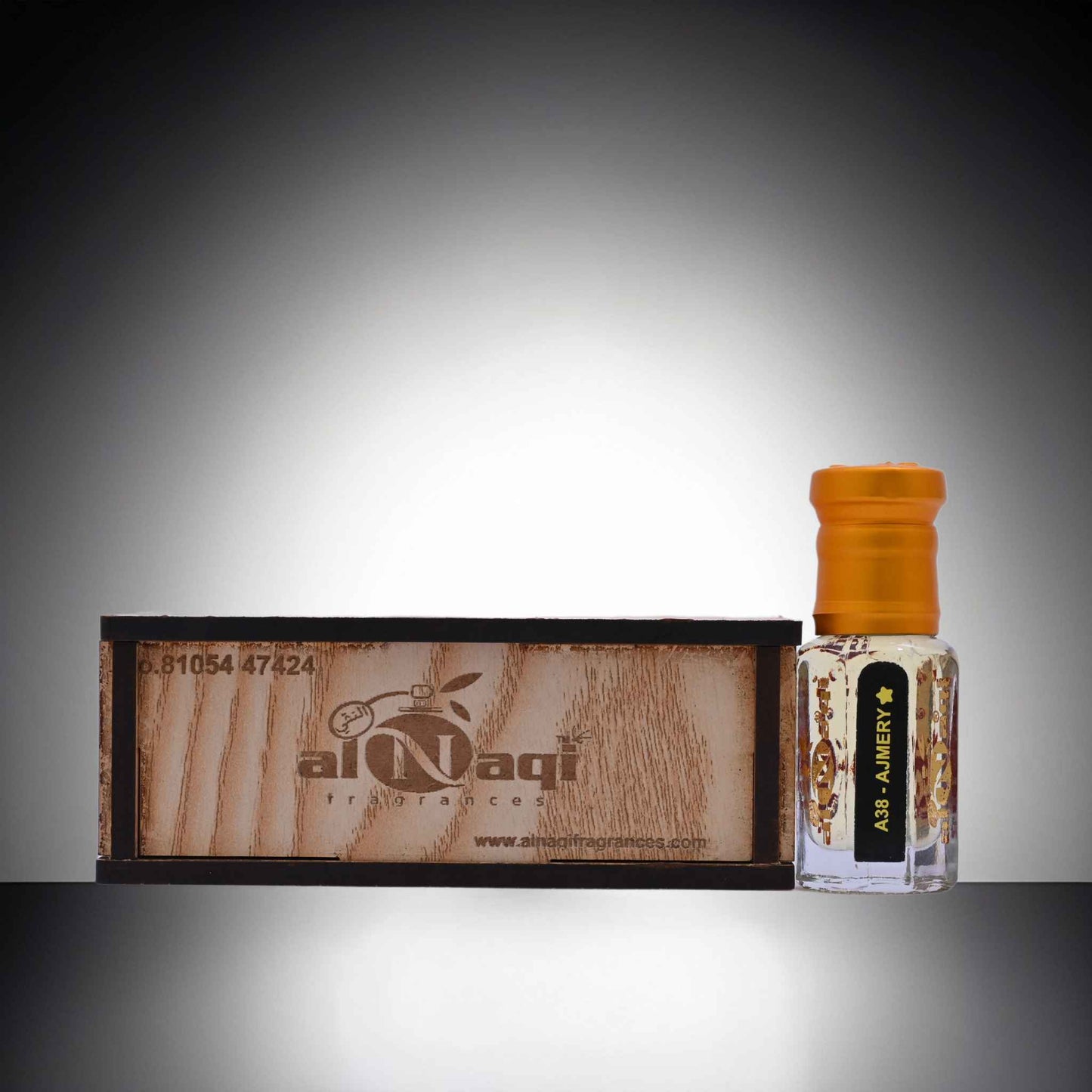 Al Nasir perfume bottle with wooden box on a gray background